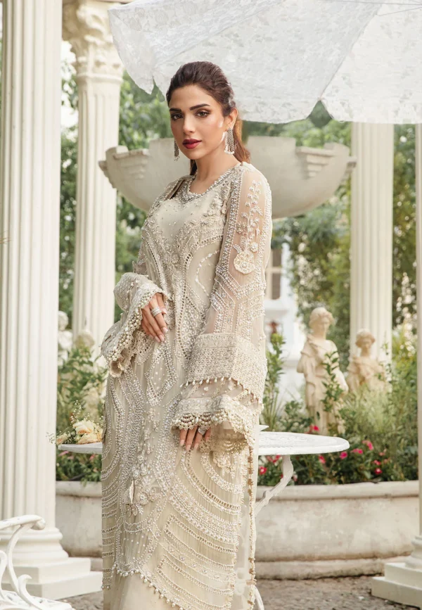 Elegant white embroidered luxury formal dress with intricate beadwork, delicate lace detailing, and a flowing dupatta."