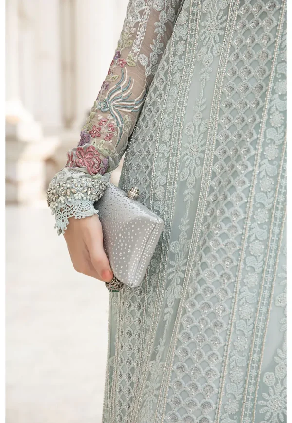 Graceful ethnic wear in soft pastel tones, with a heavily embellished long shirt, trousers, and a stylish dupatta with pink floral embroidery.