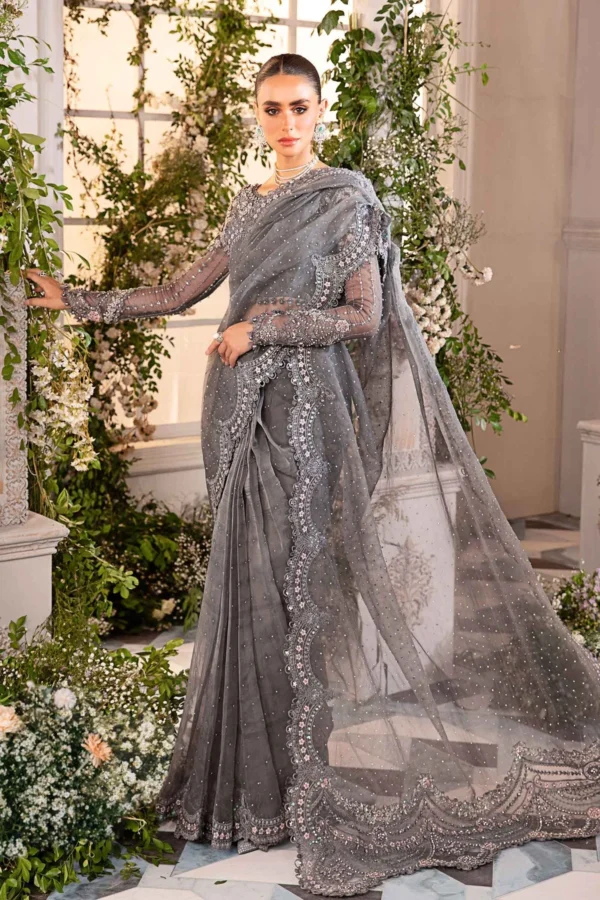 Elegant grey embroidered saree with intricate embellishments and sheer detailing, perfect for formal events.