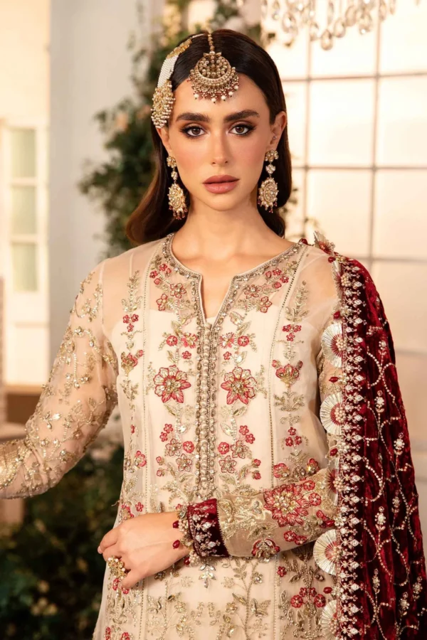 "Traditional South Asian Bridal Wear – A stunning beige and gold ensemble featuring delicate floral embroidery and a rich red velvet dupatta."