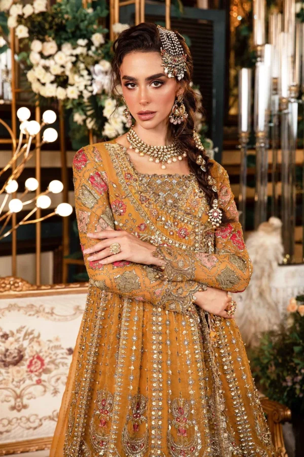 Pakistani Designer Bridal Wear – Stunning handcrafted Pakistani bridal dress in mustard gold with detailed embellishments, paired with a luxurious dupatta.