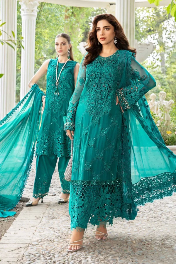 "Elegant teal Pakistani formal wear with intricate lace embroidery and net dupatta, perfect for Eid and festive occasions."