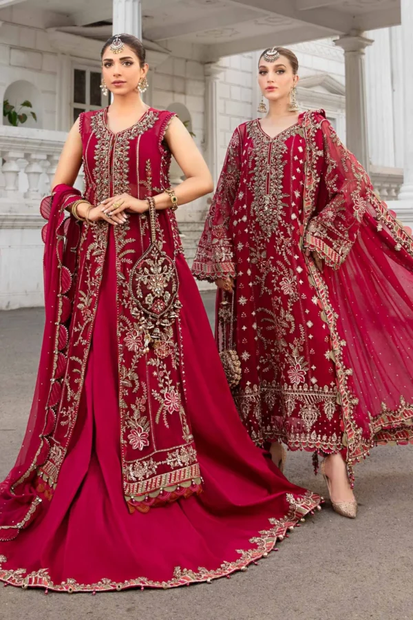 "Luxurious maroon Pakistani bridal outfit with intricate gold embroidery, handcrafted embellishments, and regal dupatta for a stunning wedding look."