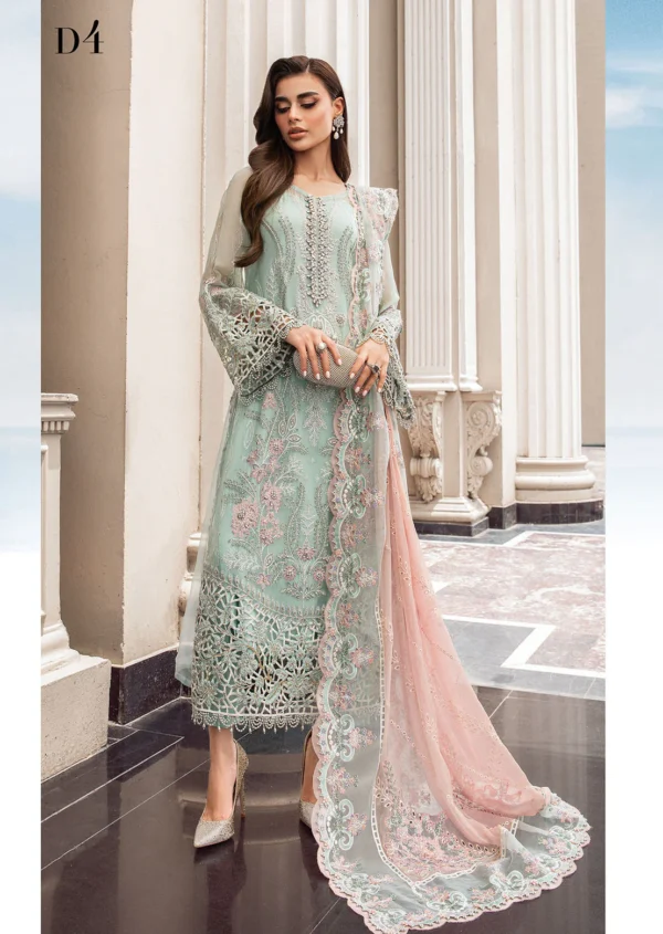 "Elegant pastel green Pakistani formal dress with intricate embroidery, laser-cut lace details, and a soft pink embellished dupatta for a sophisticated look."
