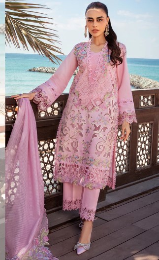 Luxury designer pink Schiffli outfit with intricate laser embroidery and floral motifs.