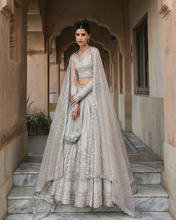 Bride wearing a silver bridal lehenga choli with embroidery ✨