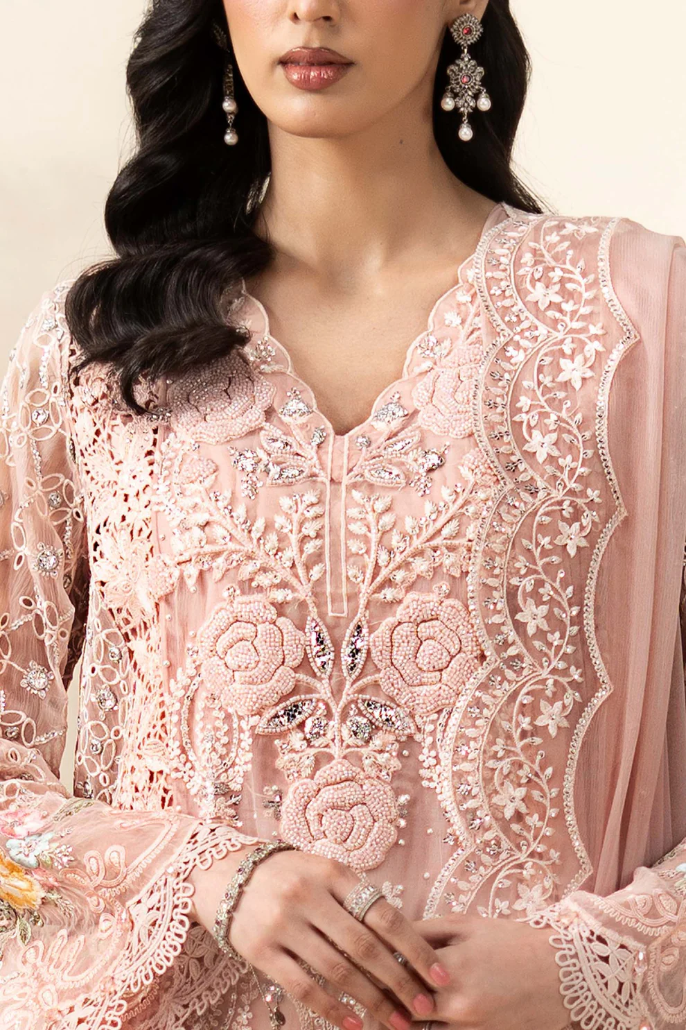 Festive Details on Blush Pink Chiffon Suit Blush pink chiffon suit with floral embroidery on sleeve