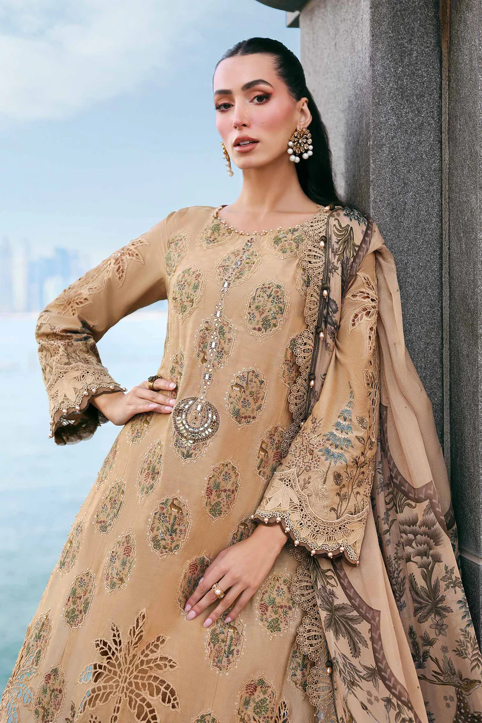Stunning golden beige lawn suit with medallion embroidery & pearl drop details Premium 3 piece golden lawn suit with medallion embroidery and scalloped lace borders