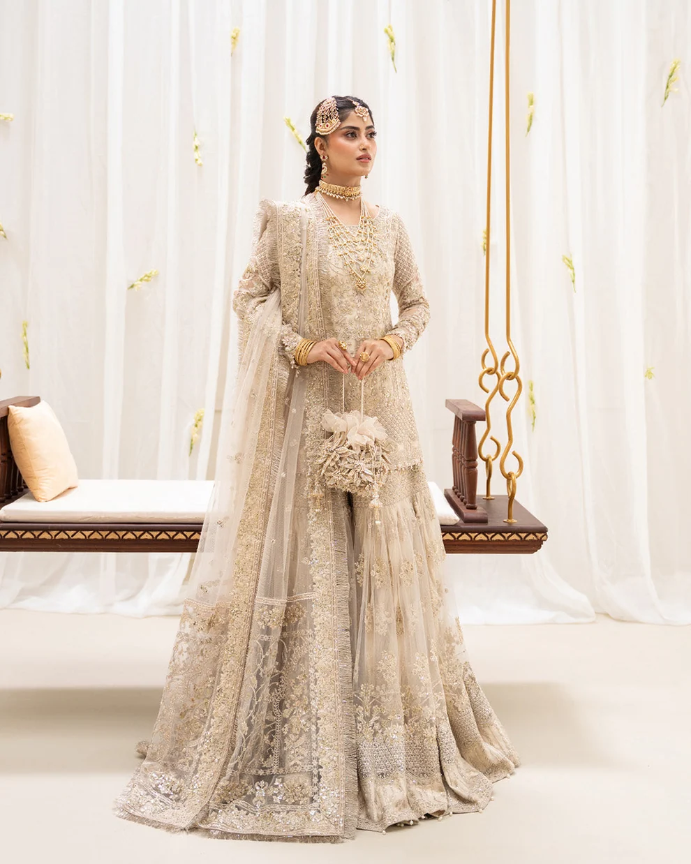 Ivory Gold Bridal Gharara Online Pakistan Bride in ivory gold embroidered bridal gharara online Pakistan with net dupatta